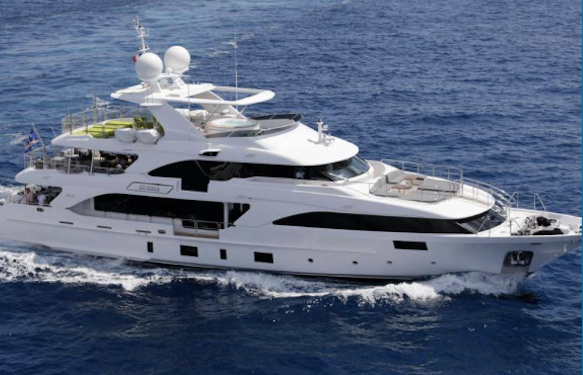 Motor yacht underway with flybridge and hardtop glazing